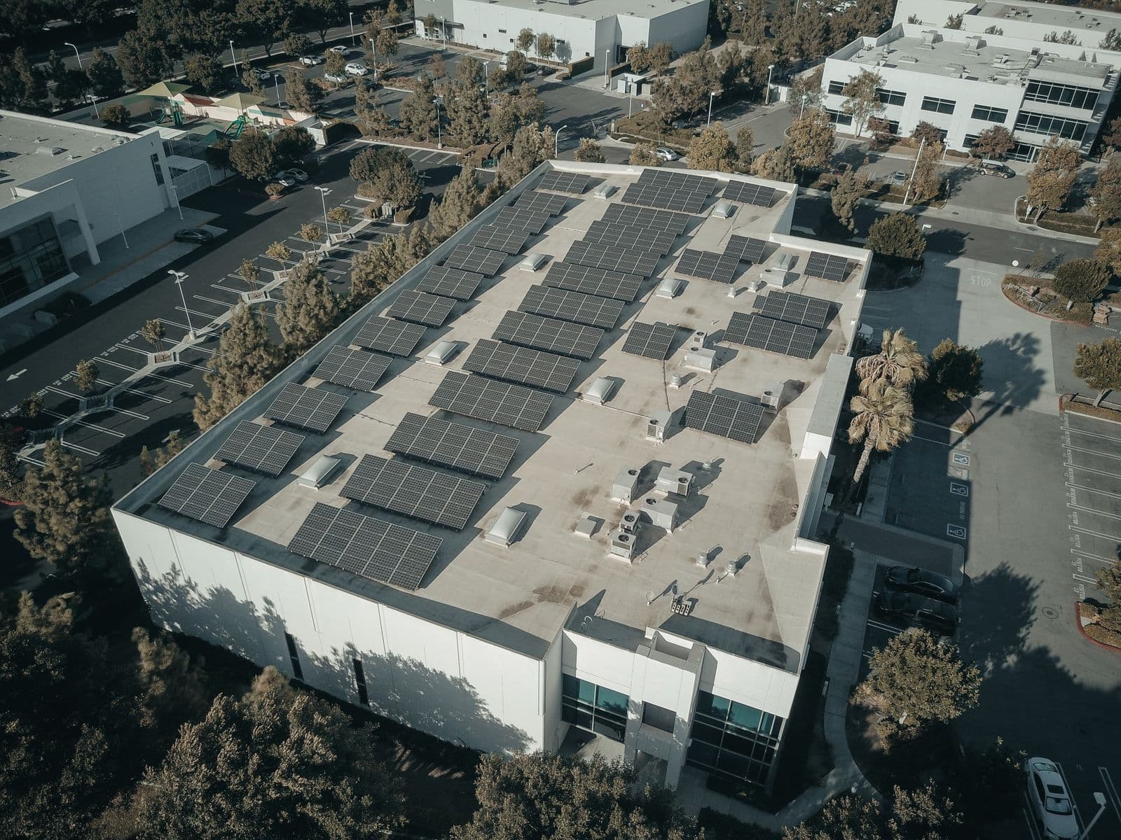 Solar panels installed across a modern building rooftop